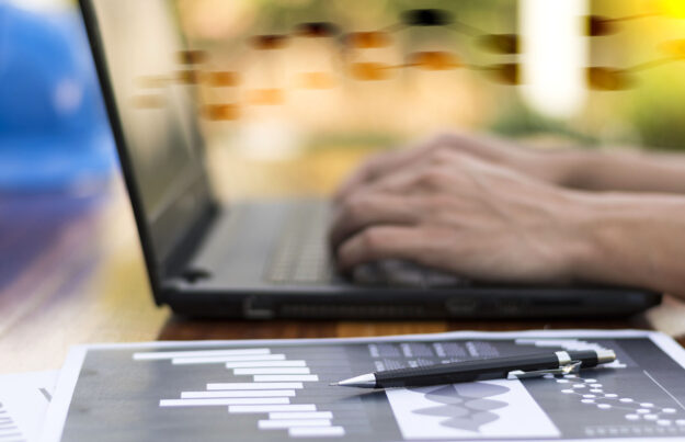 businessman hand working with new modern computer and business s