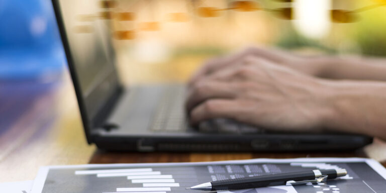 businessman hand working with new modern computer and business s